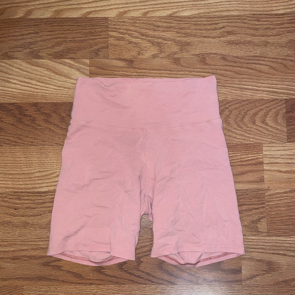 Aritzia TNA peach biker shorts